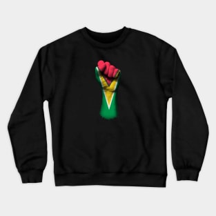 Flag of Guyana on a Raised Clenched Fist Crewneck Sweatshirt